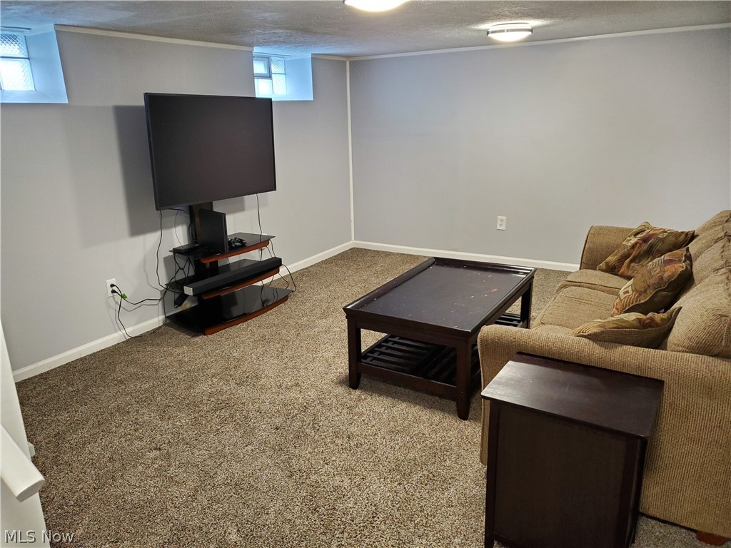 5615 Ridgewood Avenue Parma, OH 44129 - Photo 13 of 19 Double sided rec room with new carpeting, professionally waterproofed from outside. Glass block windows