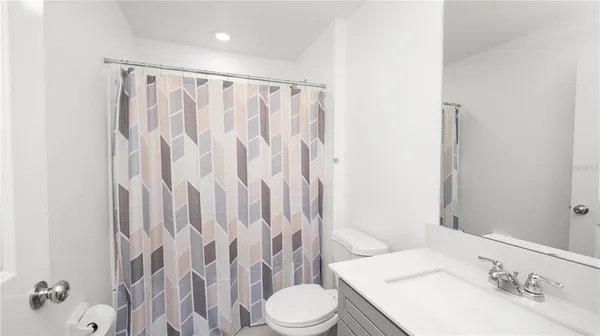 a bathroom with a sink and toilet