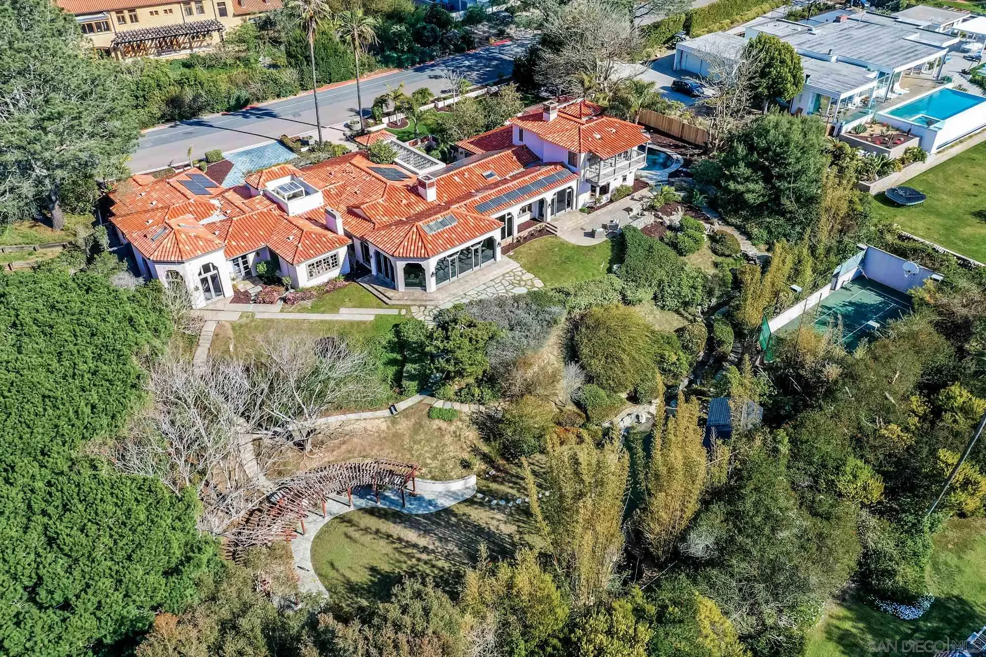 an aerial view of a house with a garden