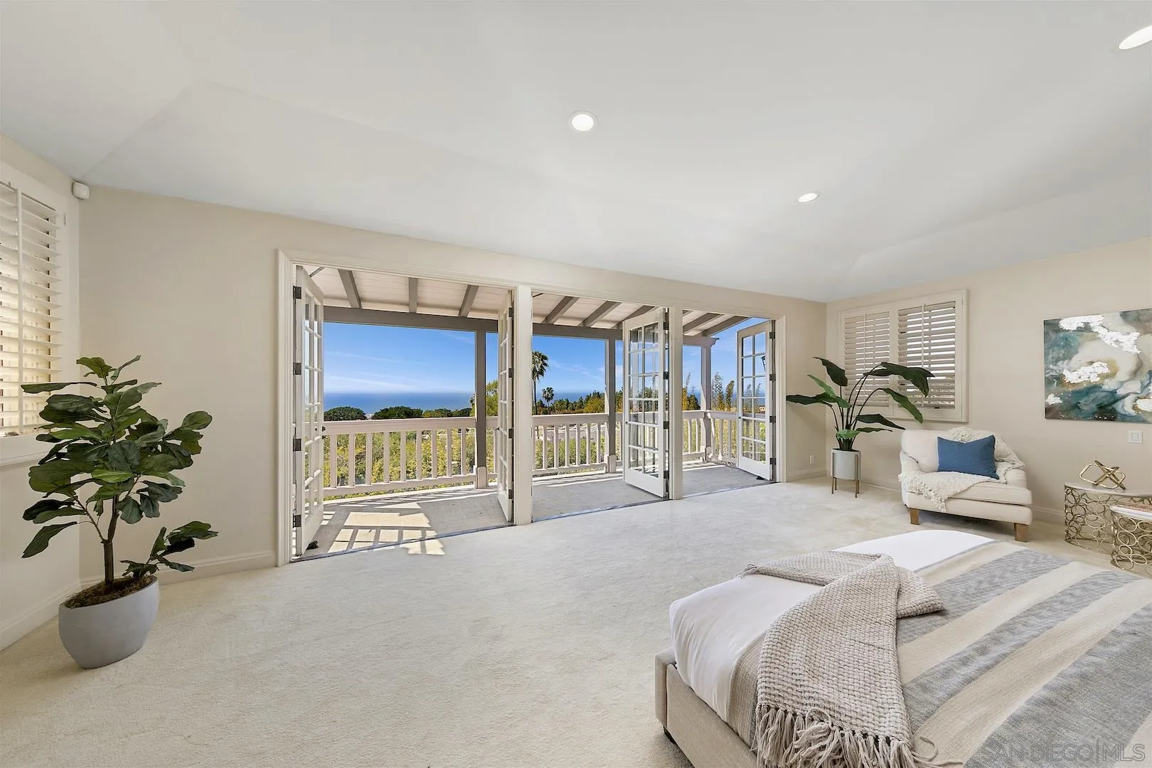 9660 Blackgold Road La Jolla, CA 92037 - Photo 21 of 32 a bed room with a bed and a potted plant