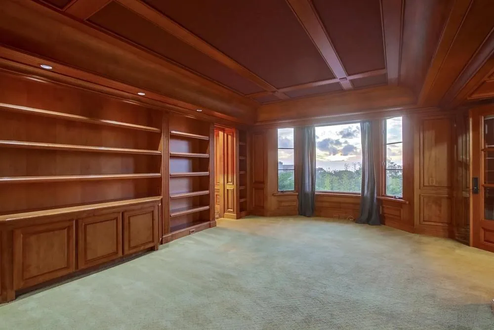 9660 Blackgold Road La Jolla, CA 92037 - Photo 24 of 32 a view of an empty room with furniture and a window
