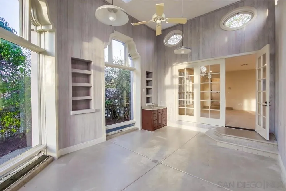 9660 Blackgold Road La Jolla, CA 92037 - Photo 27 of 32 a view of a big room with windows and chandelier