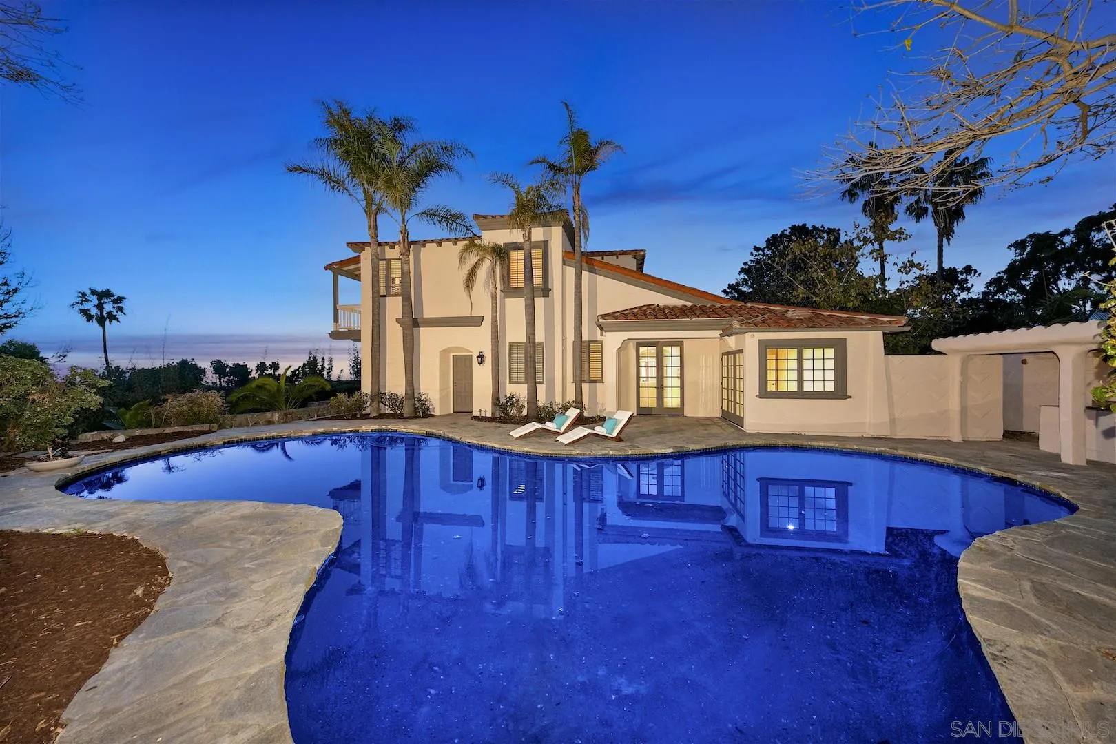 9660 Blackgold Road La Jolla, CA 92037 - Photo 3 of 32 a view of a house with swimming pool and sitting area