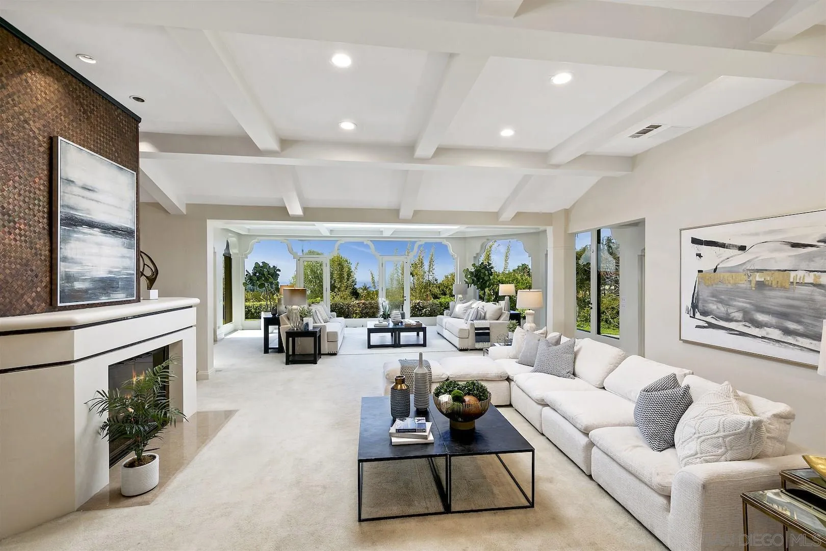 9660 Blackgold Road La Jolla, CA 92037 - Photo 8 of 32 a living room with furniture fireplace and large windows