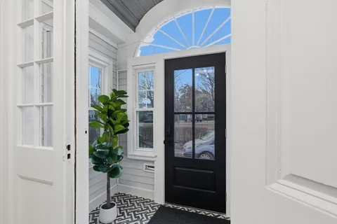 a house that has a potted plant on the wall