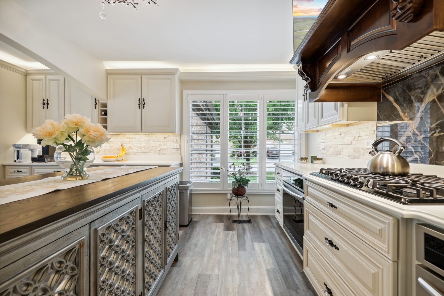 10508 Golf Road Orland Park, IL 60462 - Photo 19 of 50 a kitchen with a sink stove and cabinets