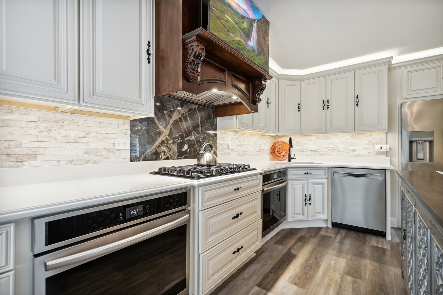 10508 Golf Road Orland Park, IL 60462 - Photo 20 of 50 a kitchen with stainless steel appliances granite countertop a stove and white cabinets