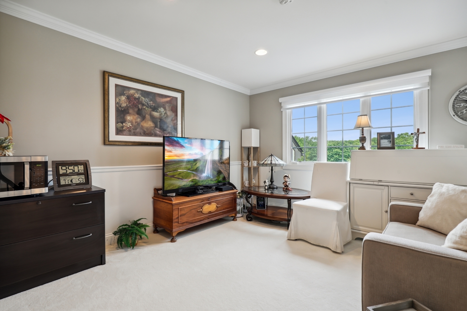 10508 Golf Road Orland Park, IL 60462 - Photo 28 of 50 a living room with furniture and a flat screen tv