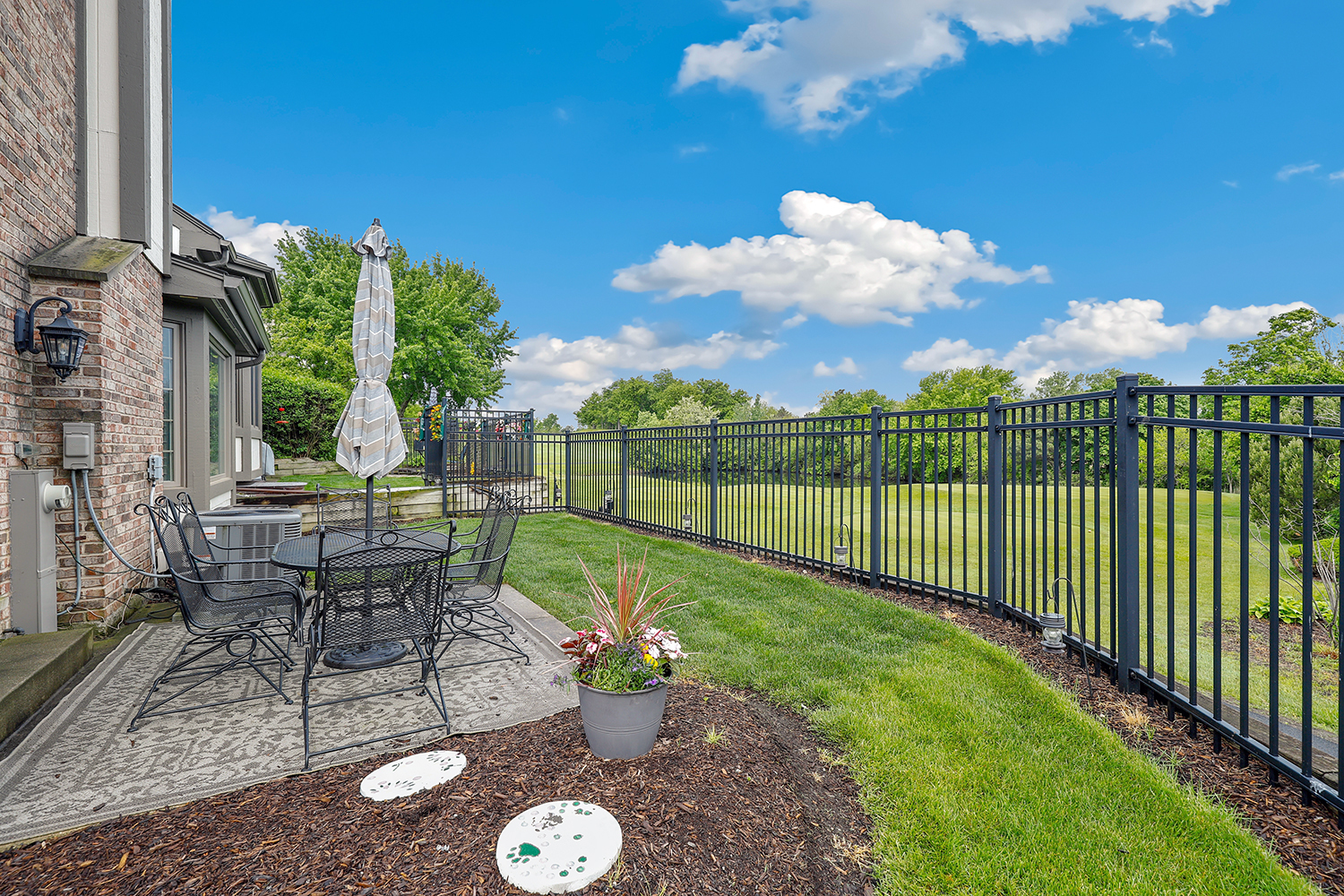 10508 Golf Road Orland Park, IL 60462 - Photo 36 of 50 a view of a chair and tables in the backyard