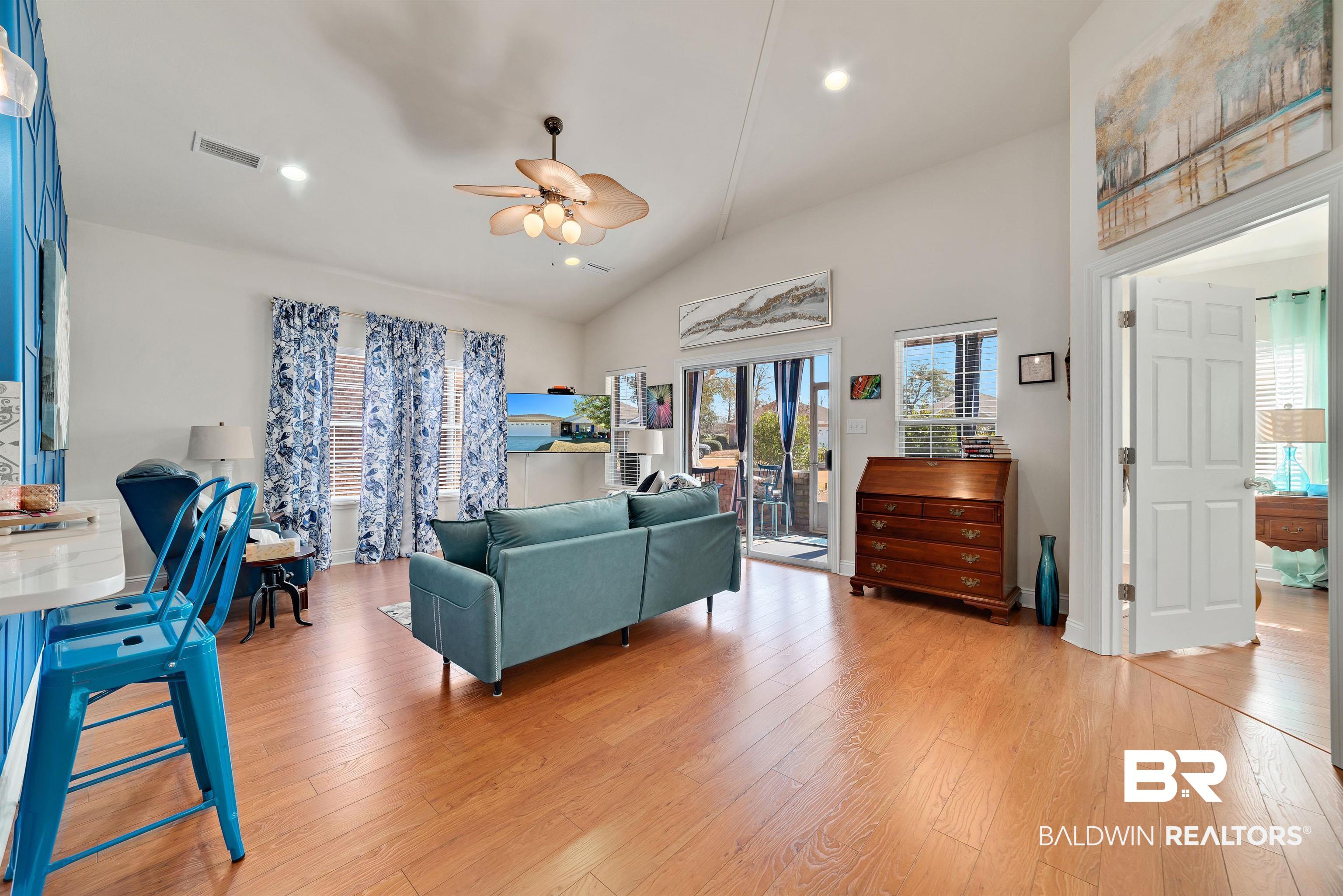 218 Hemingway Loop Foley, AL 36535 - Photo 11 of 39 Living room with light wood-style floors, ceiling fan, recessed lighting, and high vaulted ceiling