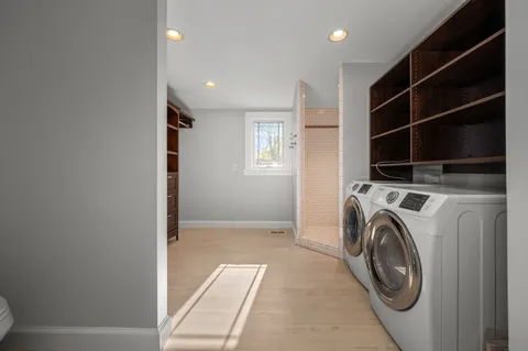 a view of livingroom with washer and dryer