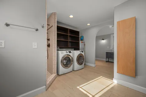 a view of a storage & utility room with washer and dryer