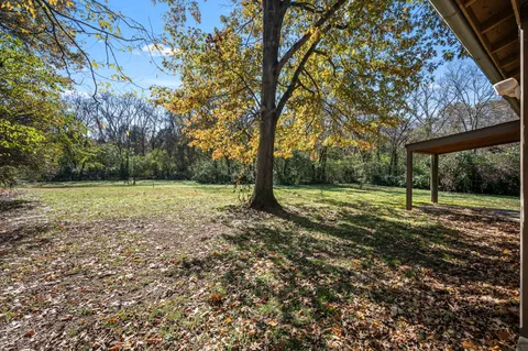 a view of outdoor space with deck and green space