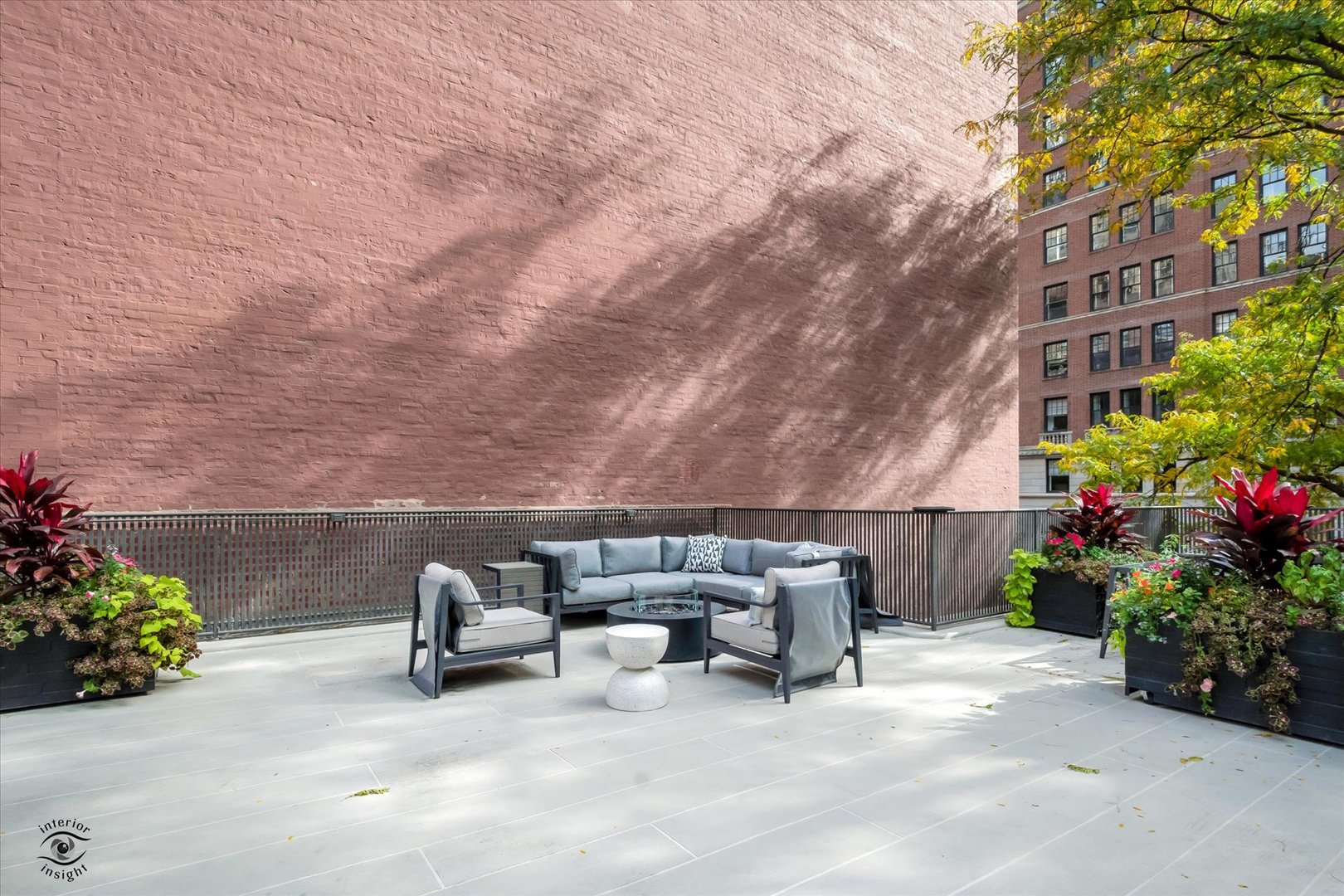 200 East Delaware Place, Unit 26E Chicago, IL 60611 - Photo 20 of 28 a view of backyard with seating space and trees