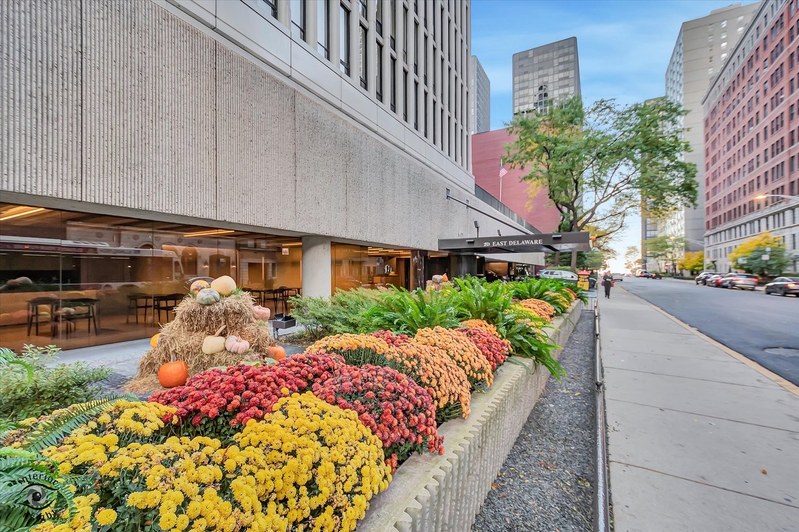 200 East Delaware Place, Unit 26E Chicago, IL 60611 - Photo 27 of 28 a front view of a house with a yard