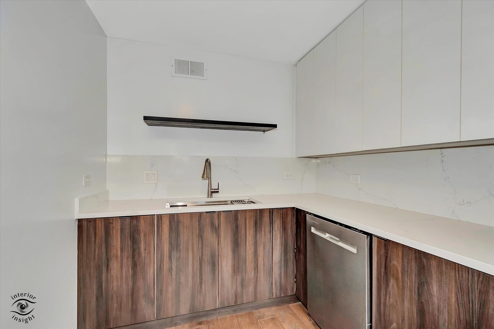200 East Delaware Place, Unit 26E Chicago, IL 60611 - Photo 10 of 28 a kitchen with a sink