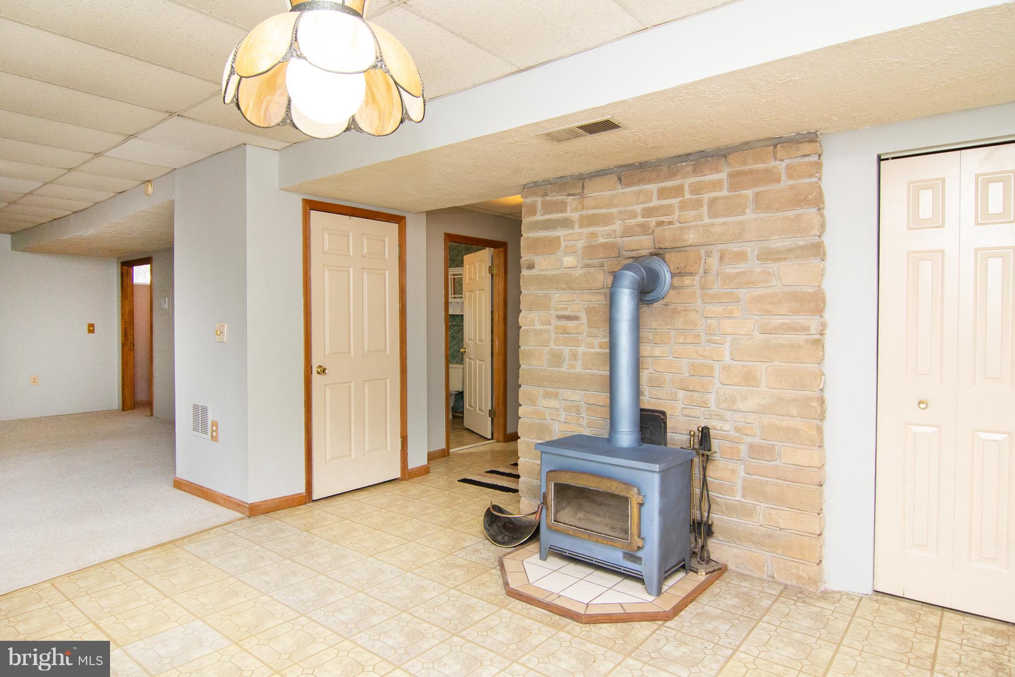 3811 Old Hanover Road Westminster, MD 21158 - Photo 19 of 34 Lower level Family Room w/wood burning stove