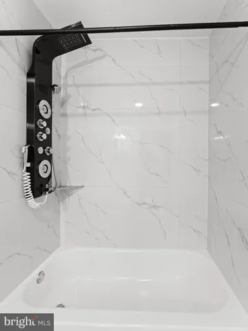 a bathroom with a shower and a shower