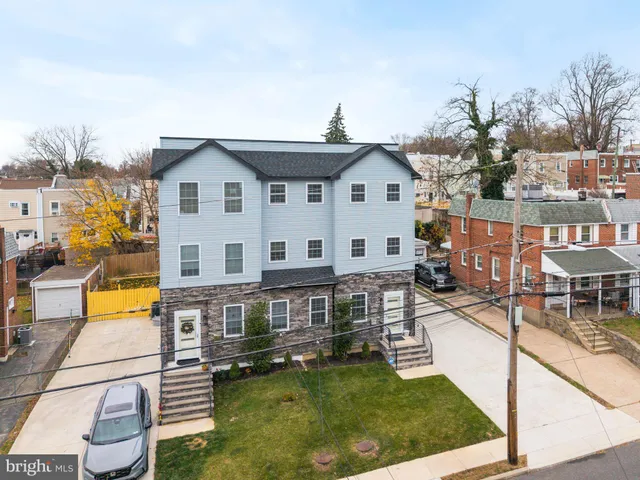 a view of a house with pool and chairs
