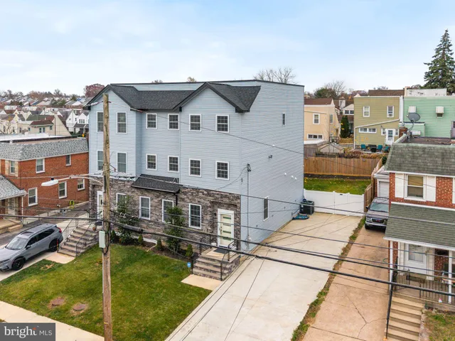 a aerial view of a house with swimming pool