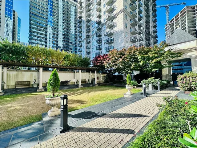 a front view of a building with garden