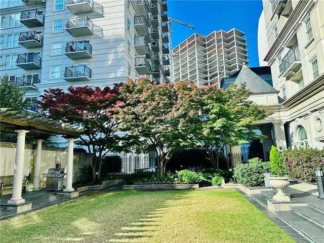 a front view of a building with garden