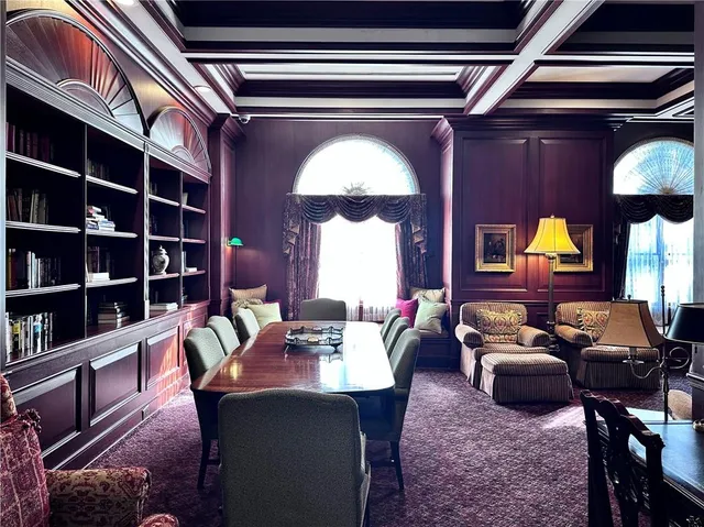 a living room with furniture and a lamp