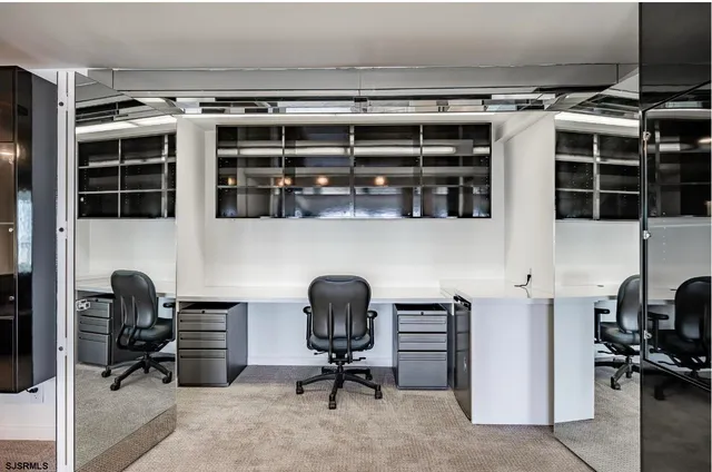 a view of a workspace with furniture