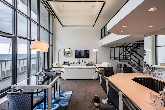 a room with furniture and view of living room