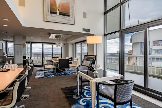 a room with gym equipment and large windows