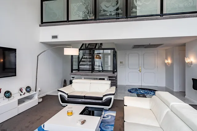 a room with furniture and flat screen tv