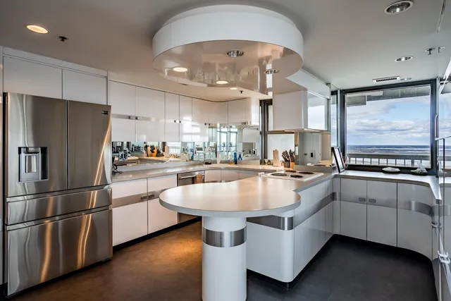 a kitchen with counter top space and stainless steel appliances
