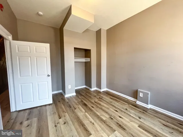 a view of a livingroom with wooden floor