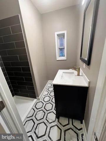 a view of kitchen island with sink and stove