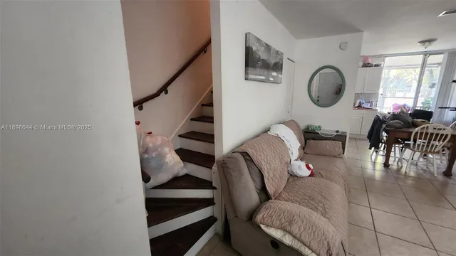 a view of a hallway to rooms