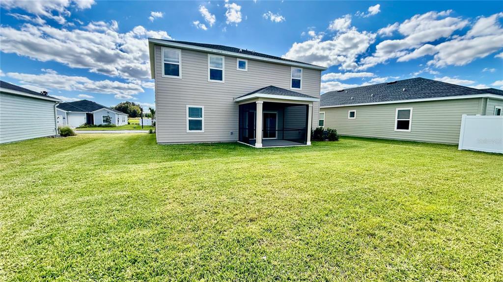 6680 Southwest 89th Loop Ocala, FL 34476 - Photo 16 of 39 a view of a house with a yard