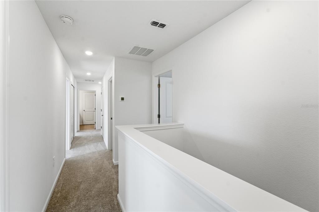6680 Southwest 89th Loop Ocala, FL 34476 - Photo 19 of 39 a view of hallway with granite countertop