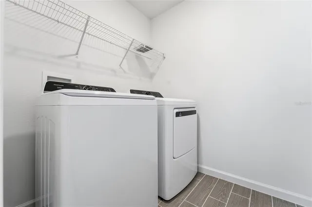 a utility room with dryer and washer