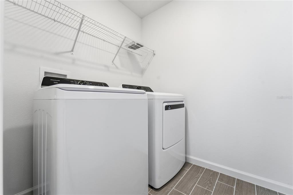 6680 Southwest 89th Loop Ocala, FL 34476 - Photo 20 of 39 a utility room with dryer and washer