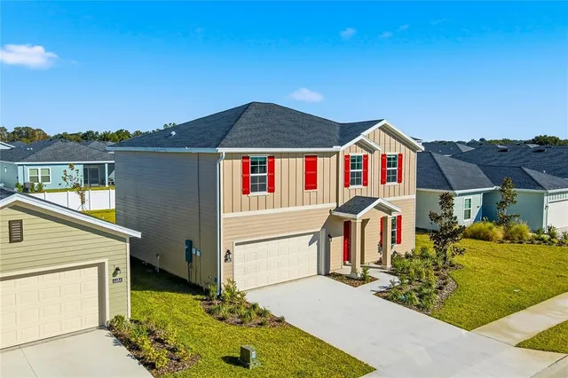a view of multiple houses with a street