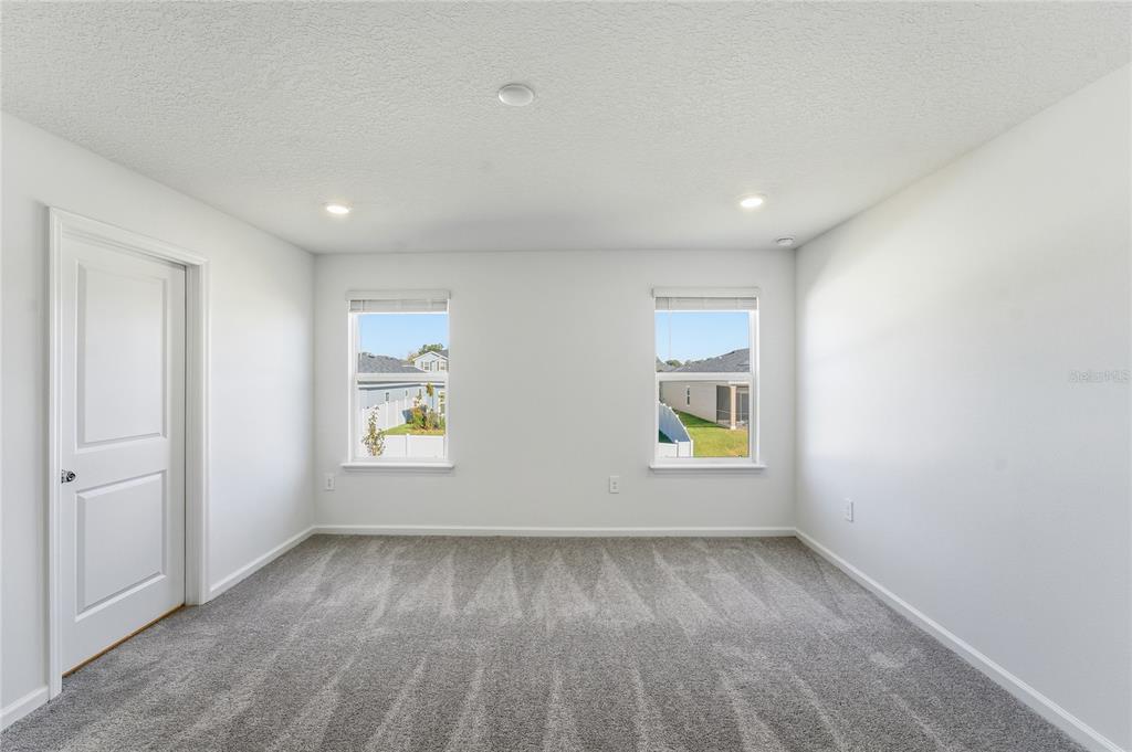 6680 Southwest 89th Loop Ocala, FL 34476 - Photo 21 of 39 an empty room with windows
