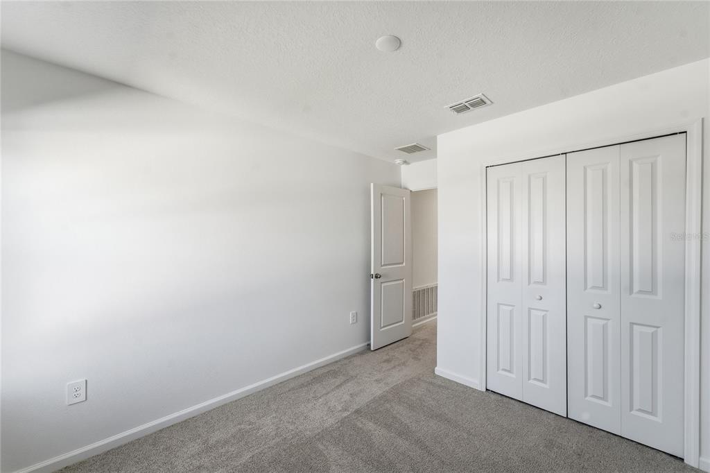 6680 Southwest 89th Loop Ocala, FL 34476 - Photo 22 of 39 wooden floor in an empty room