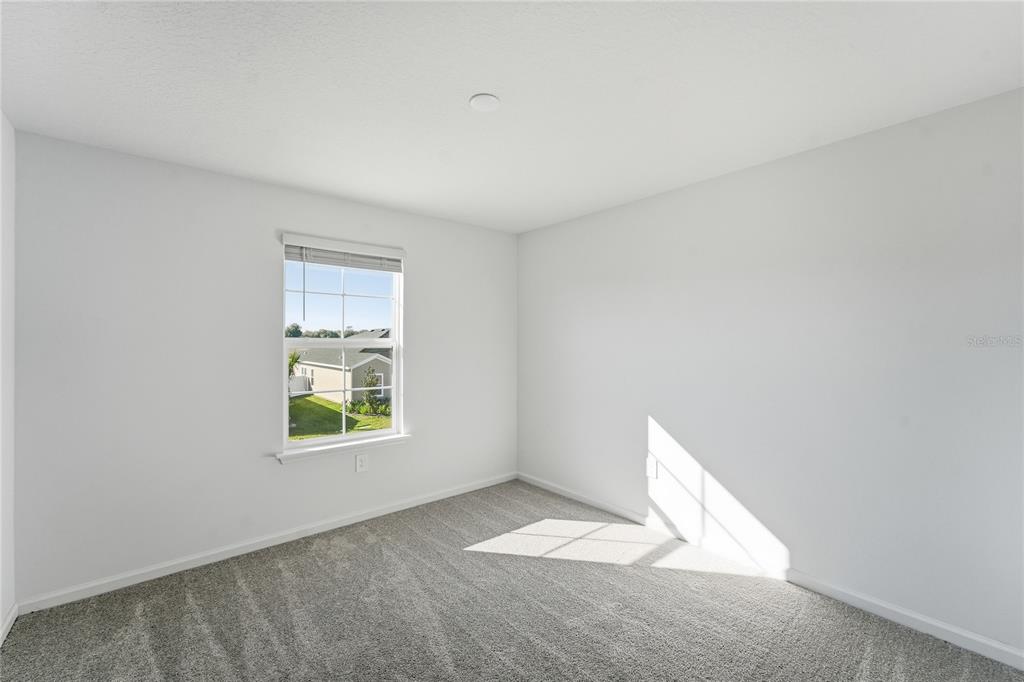 6680 Southwest 89th Loop Ocala, FL 34476 - Photo 29 of 39 an empty room with a window
