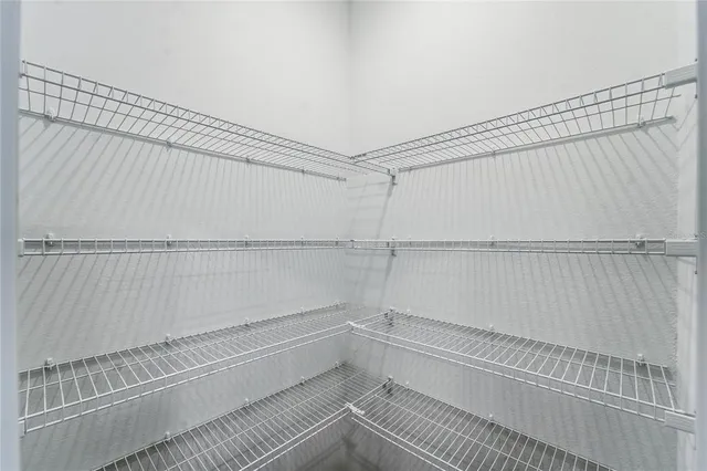 a view of a room with racks on the wall