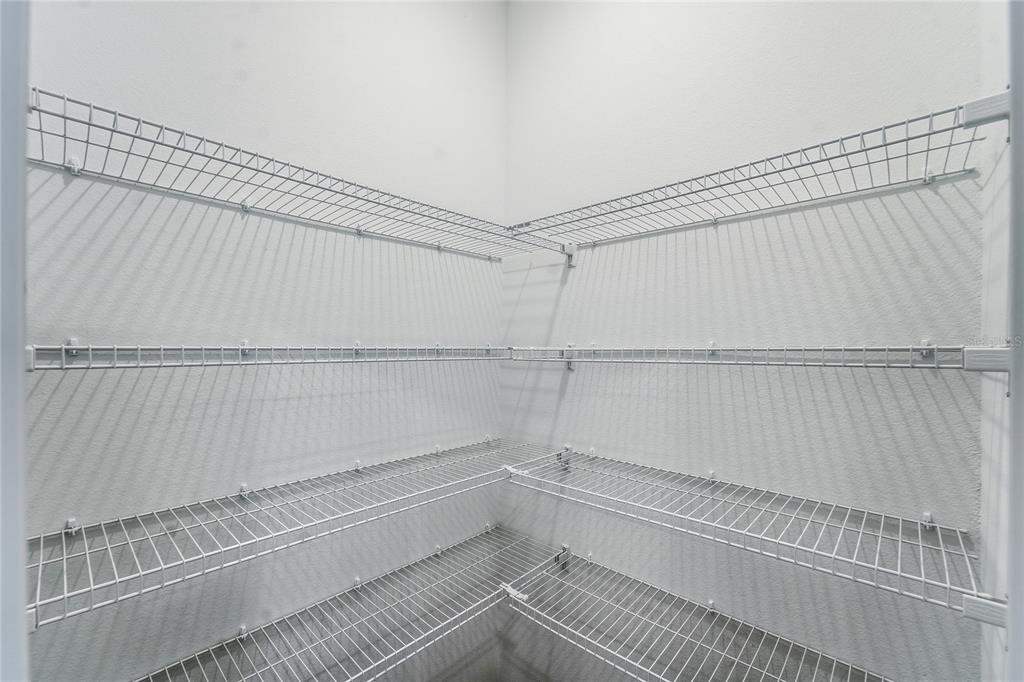 6680 Southwest 89th Loop Ocala, FL 34476 - Photo 34 of 39 a view of a room with racks on the wall