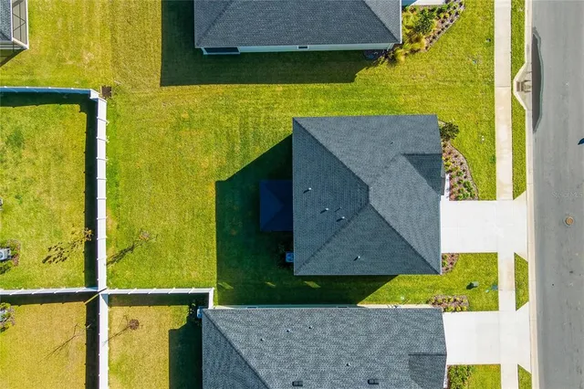 a aerial view of a house with a yard