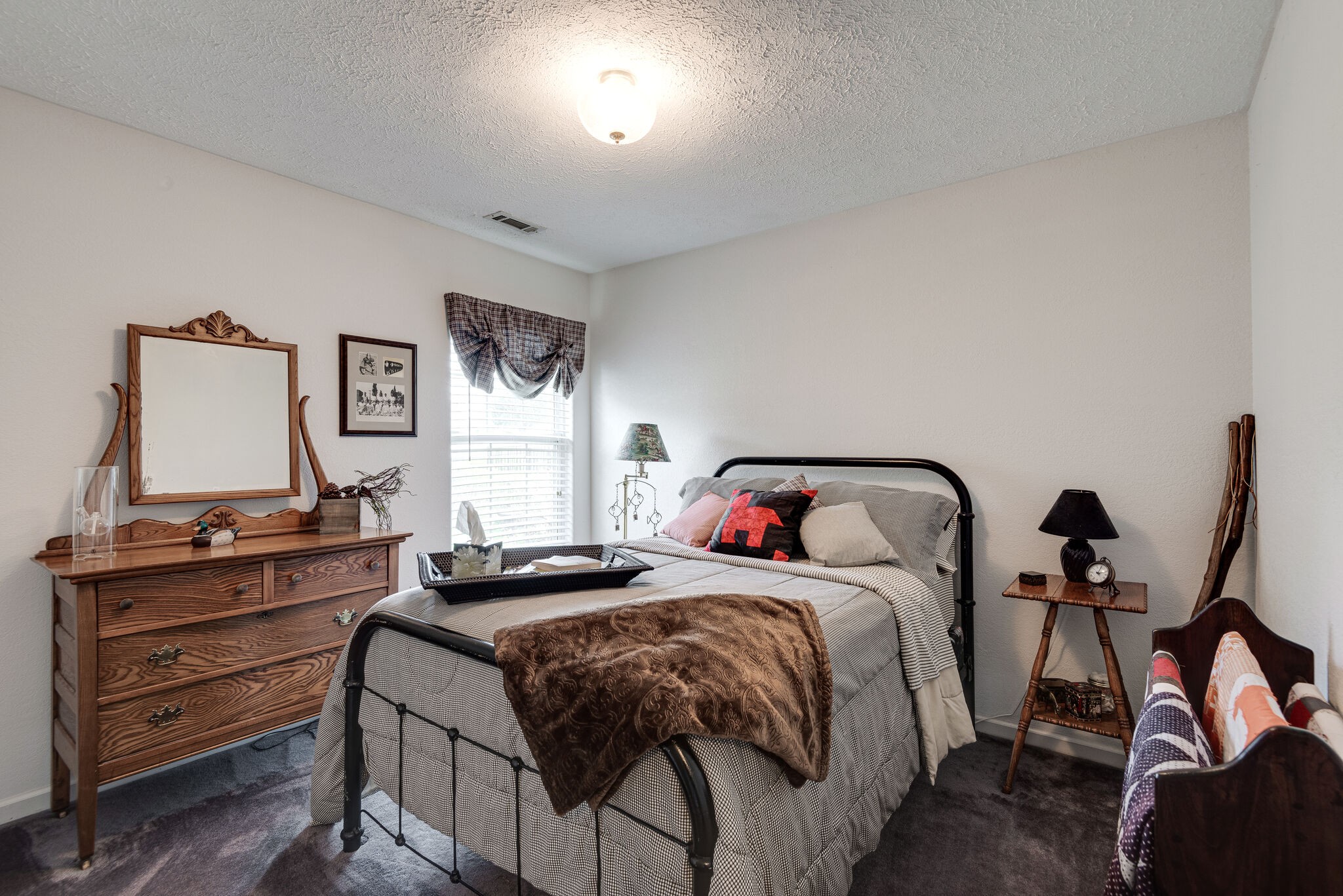 3944 Kedron Road Spring Hill, TN 37174 - Photo 21 of 31 a bedroom with a bed and a dresser