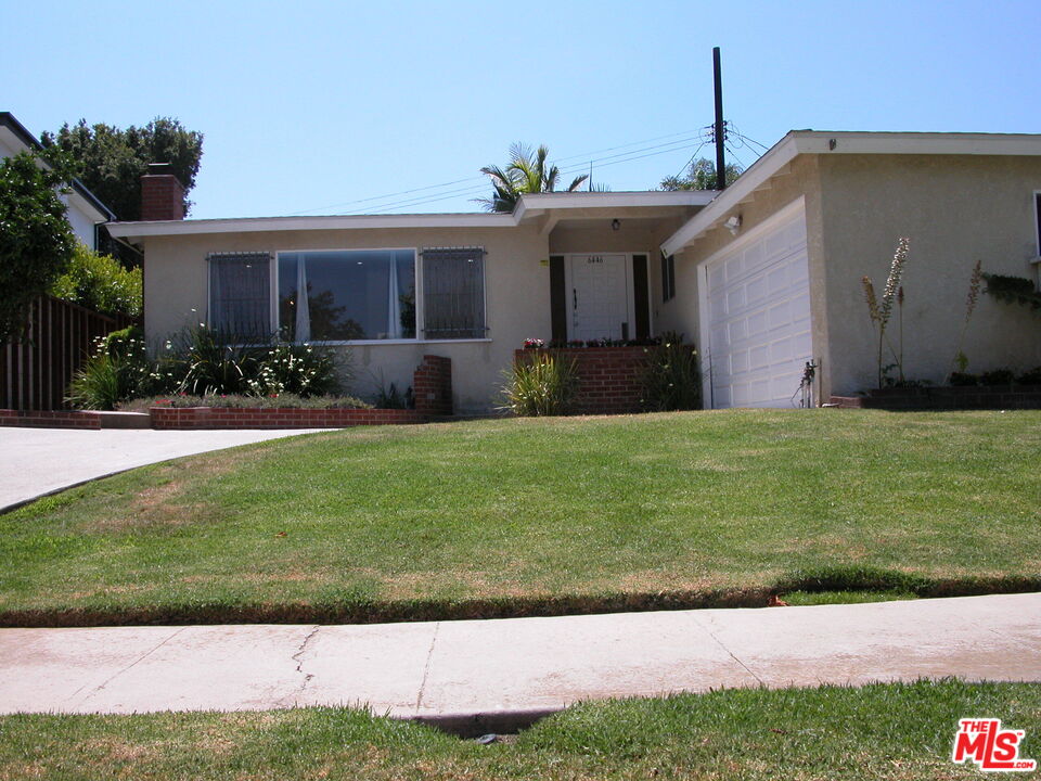 6446 Riggs Place Los Angeles, CA 90045 - Photo 2 of 22 a front view of a house with a yard