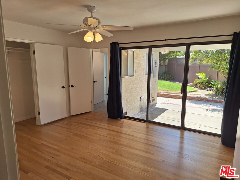 6446 Riggs Place Los Angeles, CA 90045 - Photo 6 of 22 a view of empty room with wooden floor and fan