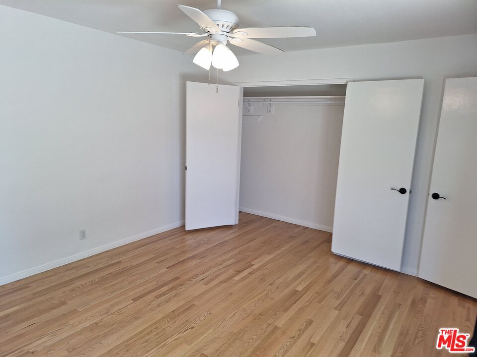 6446 Riggs Place Los Angeles, CA 90045 - Photo 7 of 22 a view of an empty room with wooden floor